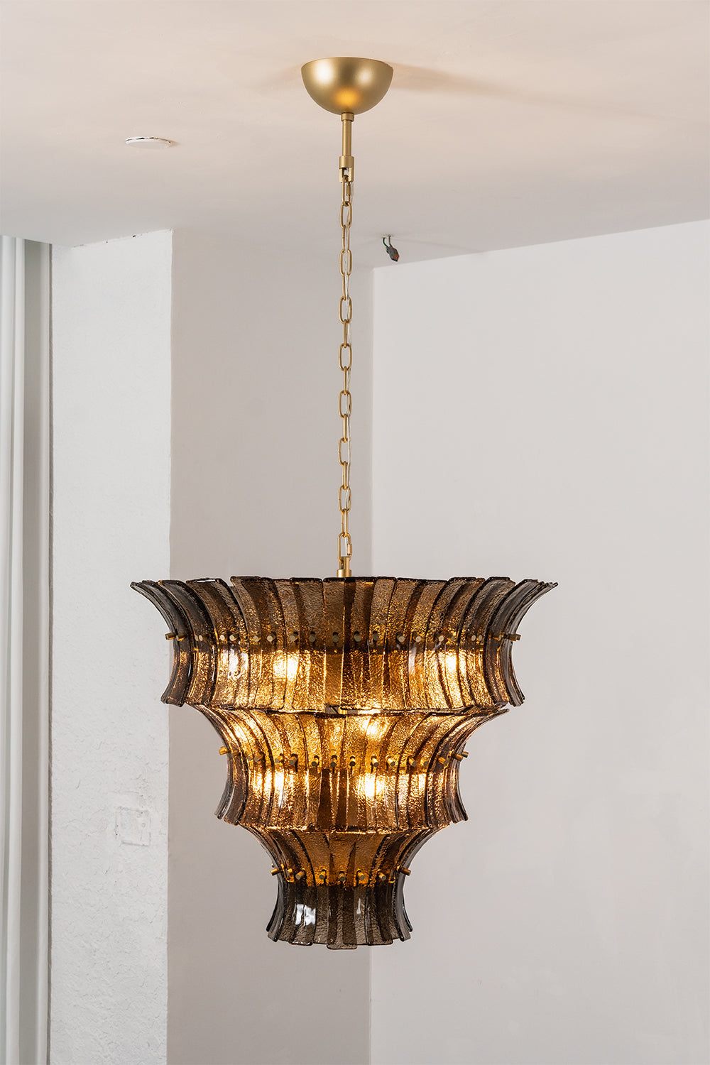 Octavia Sculptural Smoked Glass Chandelier | Studio Lit View | Full-length studio presentation of the fully illuminated tall multi-tiered conical smoked glass chandelier | vexa lamps