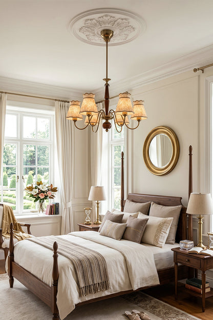 Odette Vintage Pleated Shaded Chandelier | Wood, Brass, Fabric | Providing warm ambient lighting over a four-poster wooden bed in a grand traditional bedroom with an ornate ceiling medallion | vexa lamps