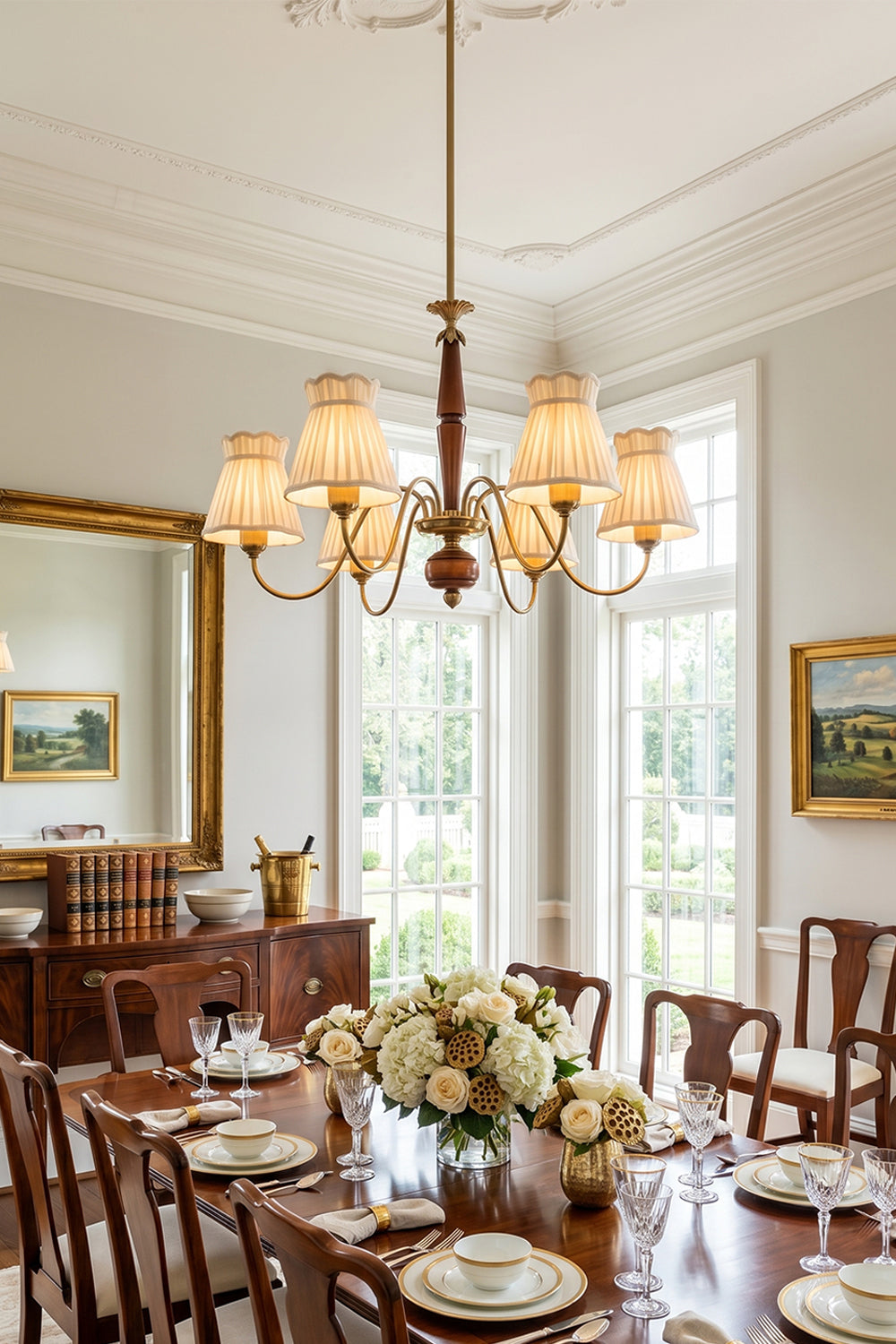 Odette Vintage Pleated Shaded Chandelier | Wood, Brass, Fabric | Illuminating a grand formal dining room setup, casting a warm cozy glow over a long wooden dining table and upholstered chairs | vexa lamps