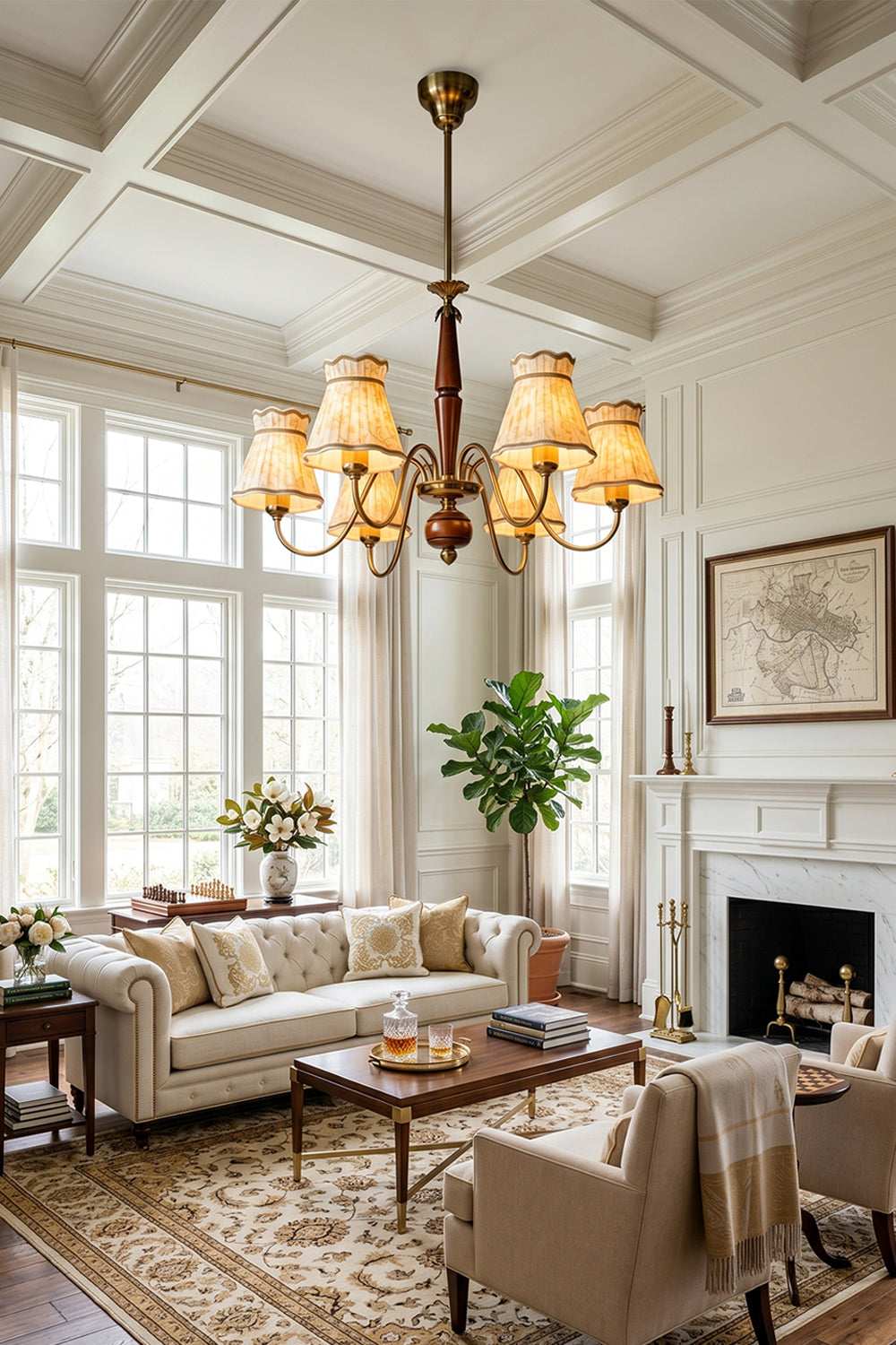 Odette Vintage Pleated Shaded Chandelier | Wood, Brass, Fabric | Wide-angle room view of the illuminated vintage shaded fixture hanging from a high paneled ceiling in a spacious luxury traditional lounge room | vexa lamps