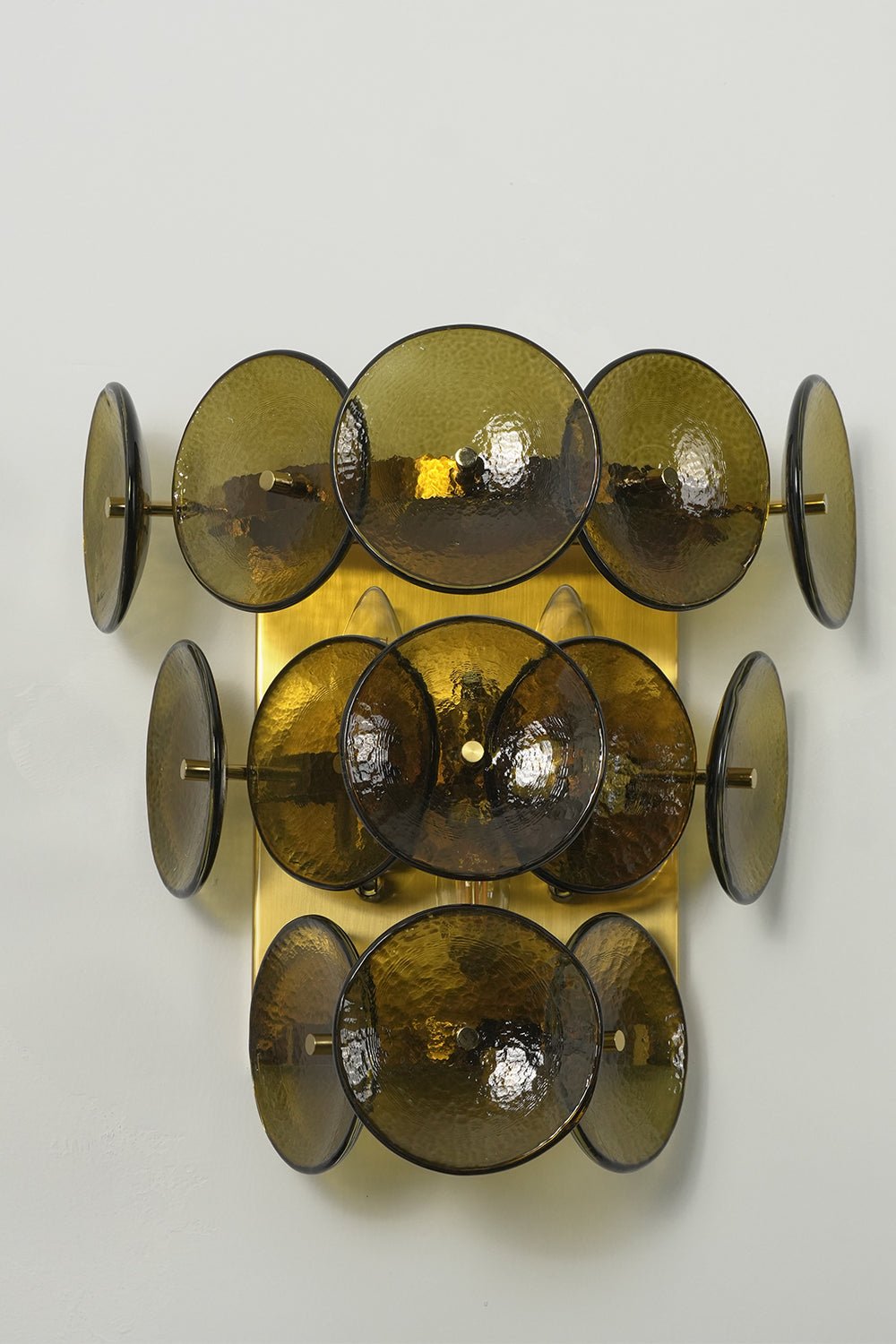 Unlit olive green glass disc wall lamp with tiered structure | Metal, Glass | Angled product view | vexa lamps