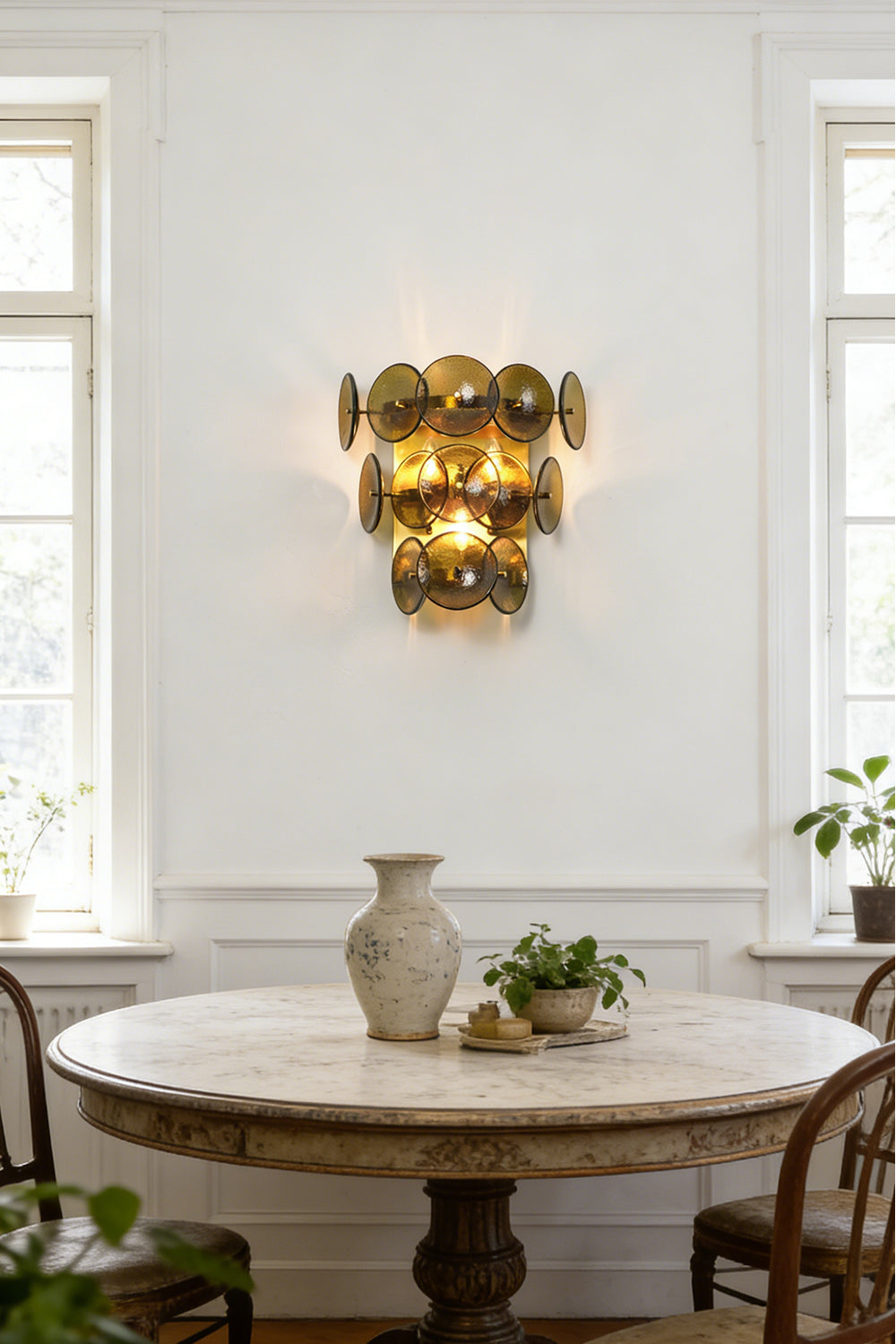 Close-up detail of lit hammered green glass discs | Glass, Metal | Showing hammered texture and warm light glow | vexa lamps