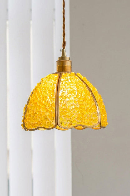Ondine Mosaic Glass Pendant Light featuring a scalloped brass-toned frame and vibrant yellow crushed glass chips.