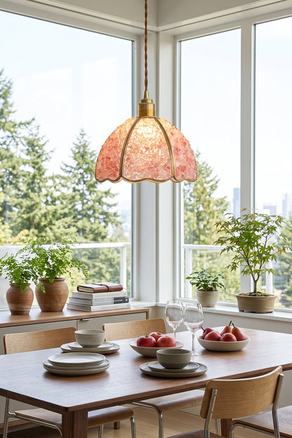 Ondine Mosaic Glass Pendant Light illuminating a bright dining space with a wooden table and natural greenery.