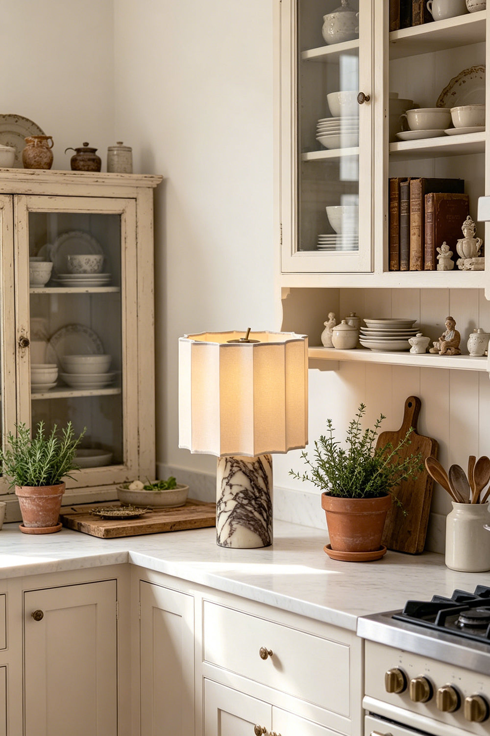Orbis Veil Pleated Marble Table Lamp illuminating a cozy kitchen with marble countertops and rustic decor.