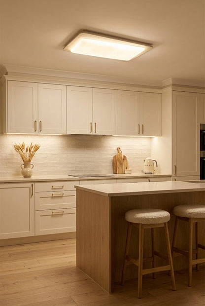 Rectangular travertine light in a white kitchen | Yellow Travertine, Acrylic | Over a kitchen island with white cabinets | vexa lamps