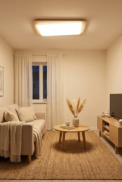 Warm travertine ceiling lamp in a small living room | Yellow Travertine, Acrylic | Above a compact sofa and jute rug | vexa lamps