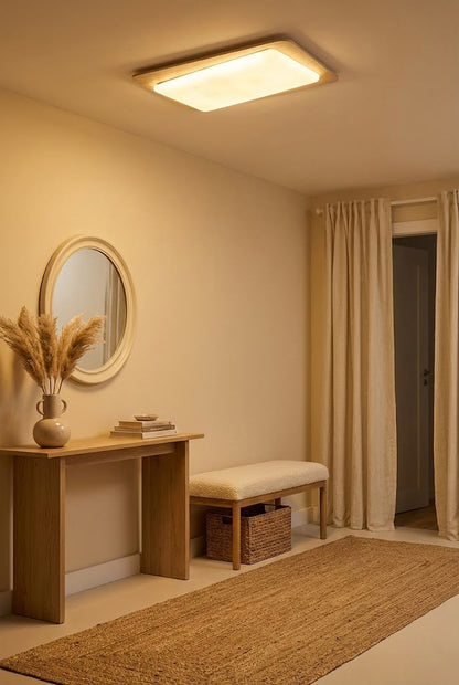 Travertine ceiling fixture in a hallway | Yellow Travertine, Acrylic | Above a wooden console table and mirror | vexa lamps