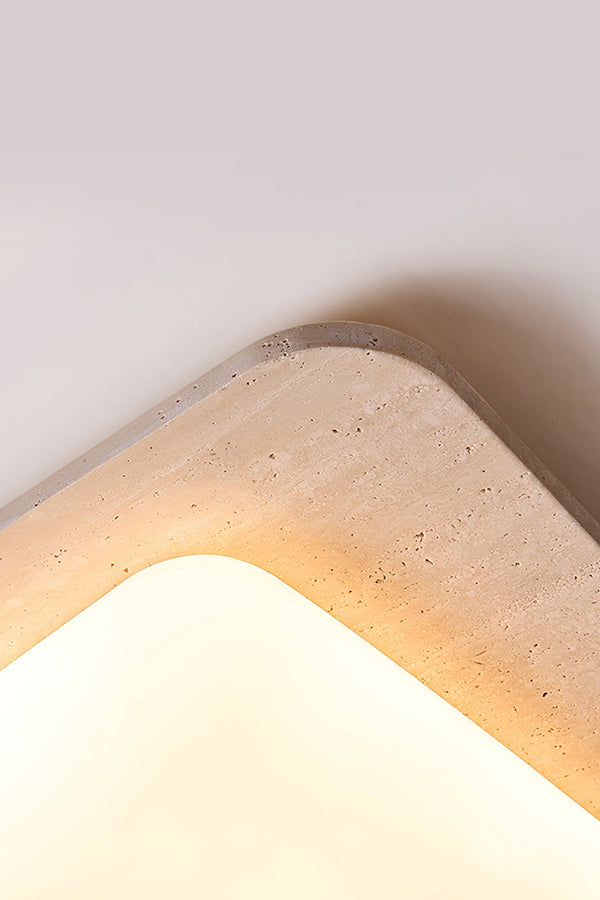Close-up of travertine corner and lit diffuser | Yellow Travertine, Acrylic | Showing the stone texture and warm light | vexa lamps