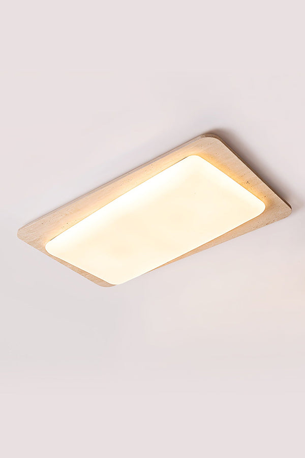 Angled product shot of travertine ceiling light | Yellow Travertine, Acrylic | Lit view isolated on white background | vexa lamps