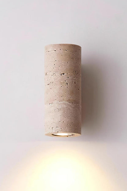 Outcrop Beige Travertine Wall Sconce | Travertine, Metal | Studio front view of the fully illuminated travertine wall fixture casting a powerful warm downlight against a white background | vexa lamps