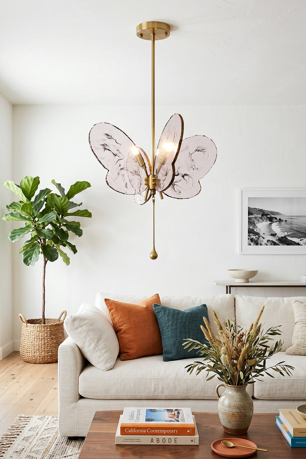 Papillon Glass Butterfly Pendant Lamp | Glass, Metal | Pink butterfly variant hanging as modern central lighting in a bright living room with a white sofa and a wooden coffee table | vexa lamps