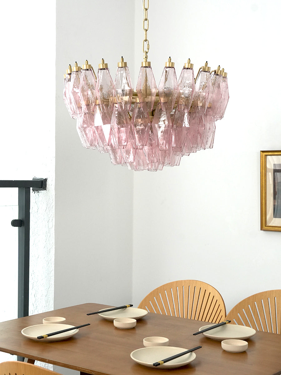 Pink art glass chandelier providing warm glow | Metal, Glass | Alternative view in a dining area over a set table | vexa lamps