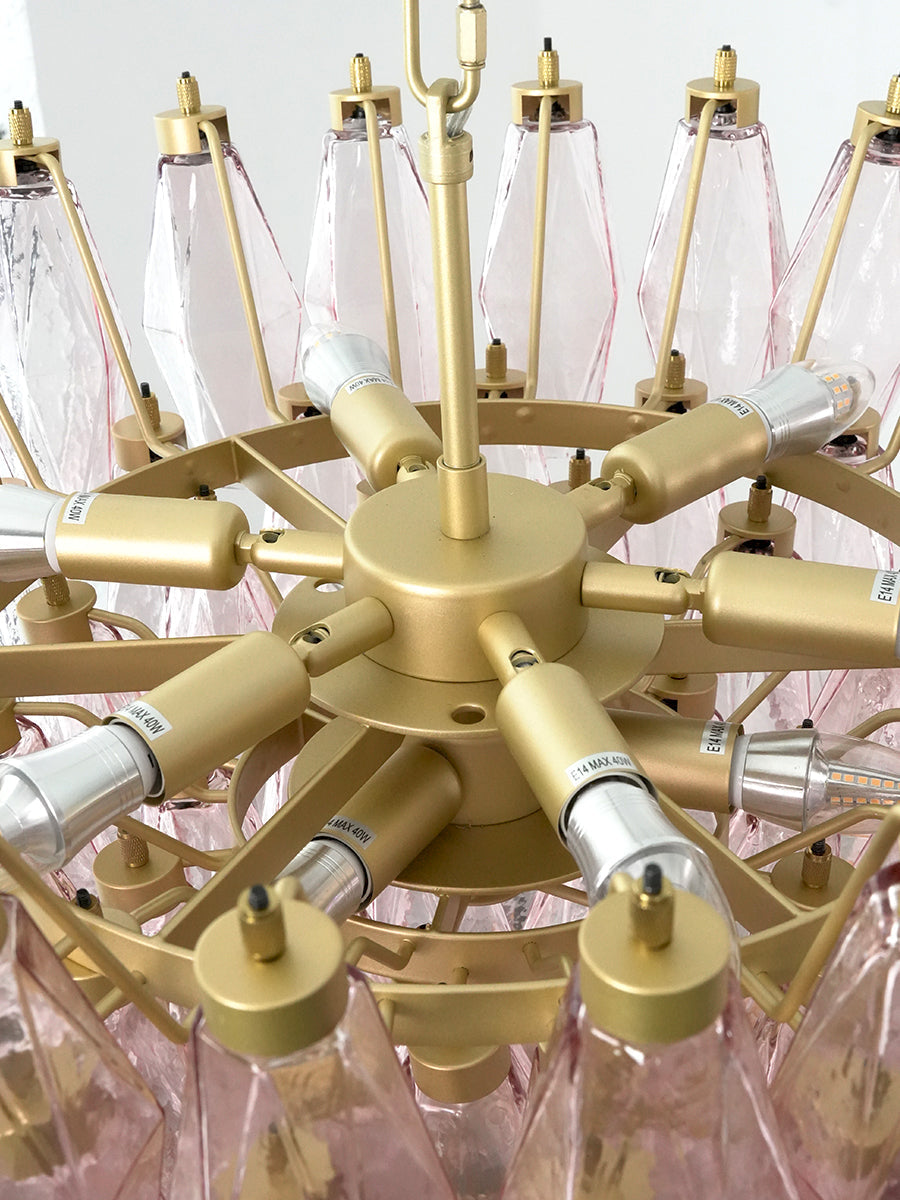 Internal metal frame and bulb sockets of pink chandelier | Metal, Glass | Top-down view showing the tiered structure | vexa lamps