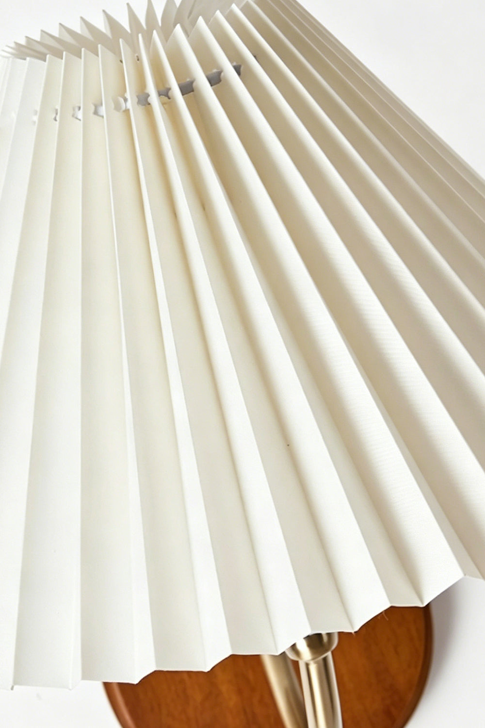 Pleated Fabric Wall Lamp | Fabric, Metal, Wood | Macro close-up of the crisp vertical folds on the unlit cream fabric lampshade | Detail shot | vexa lamps
