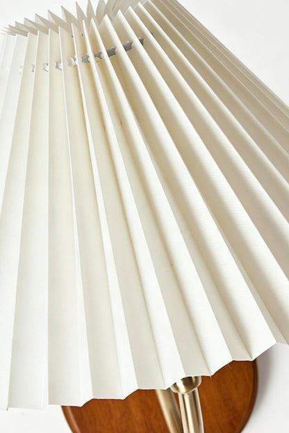 Pleated Fabric Wall Lamp | Fabric, Metal, Wood | Macro close-up of the crisp vertical folds on the unlit cream fabric lampshade | Detail shot | vexa lamps