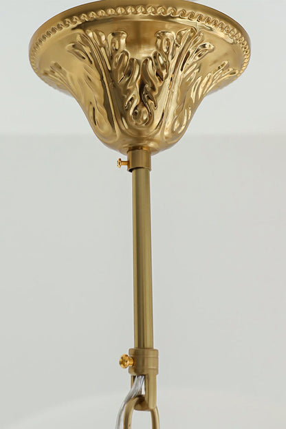 Pluma Frosted Glass Feather Chandelier | Glass, Metal | Close-up shot highlighting the ornate decorative carvings on the polished gold brass ceiling canopy and mounting rod | Detail shot | vexa lamps