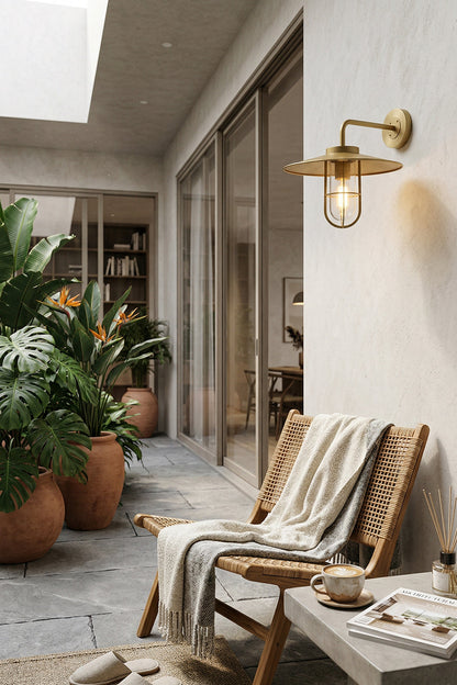 Nautical style brass wall light for outdoor balcony | Brass, Glass | Installed on a white wall near glass doors | vexa lamps