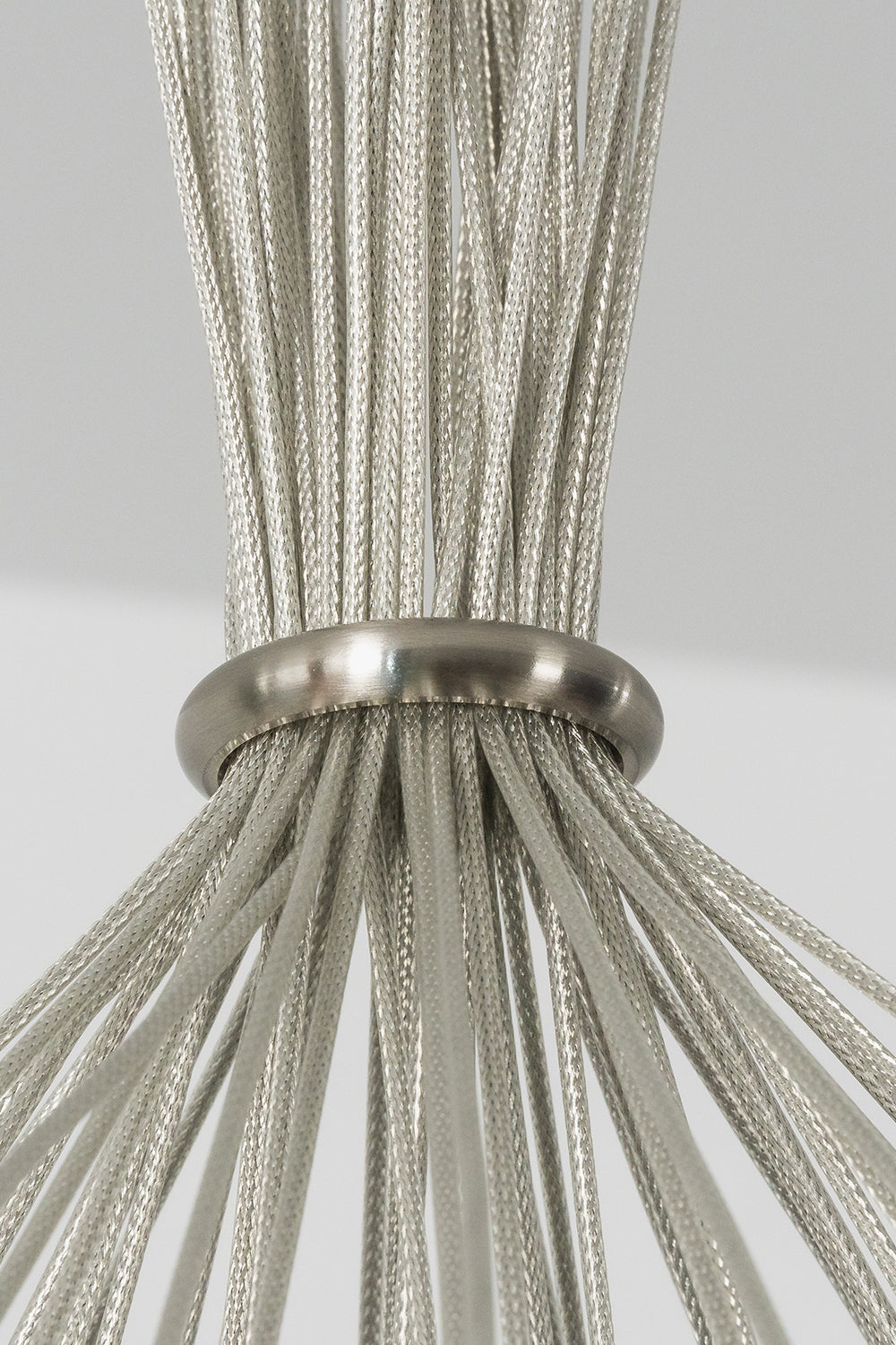 Rainbow Glass Bubble Cluster Chandelier | Glass, Metal | Close-up macro focus on the gathered silver steel mesh cables passing through a polished chrome collar ring | Detail shot | vexa lamps