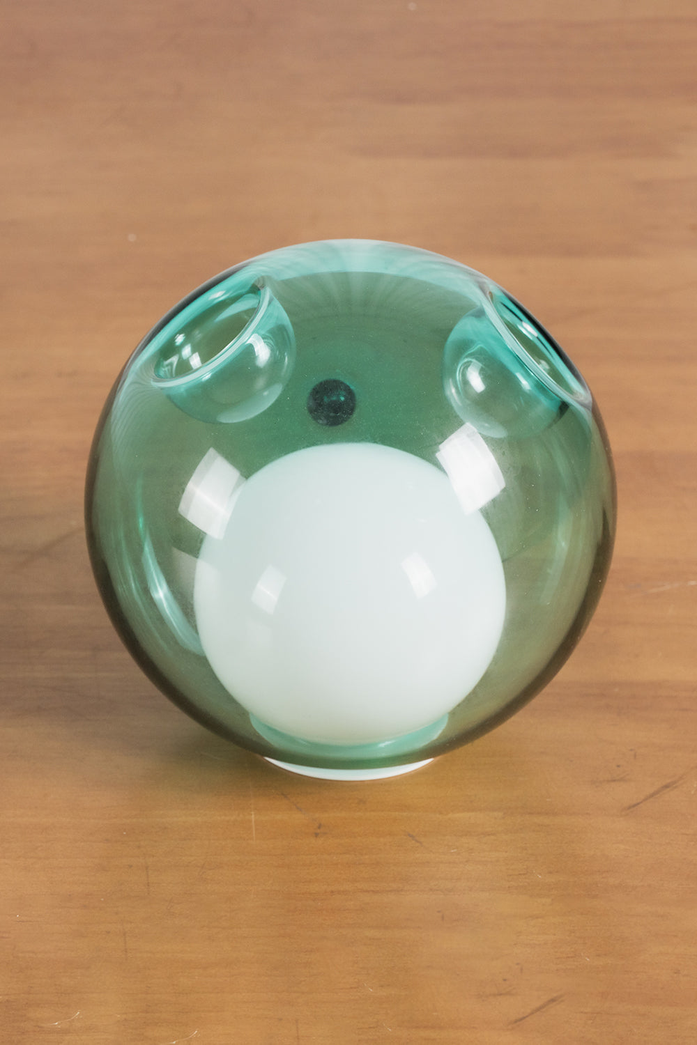 Rainbow Glass Bubble Cluster Chandelier | Glass, Metal | Detailed close-up shot of a single translucent green glass globe with an integrated white frosted core diffuser | Detail shot | vexa lamps