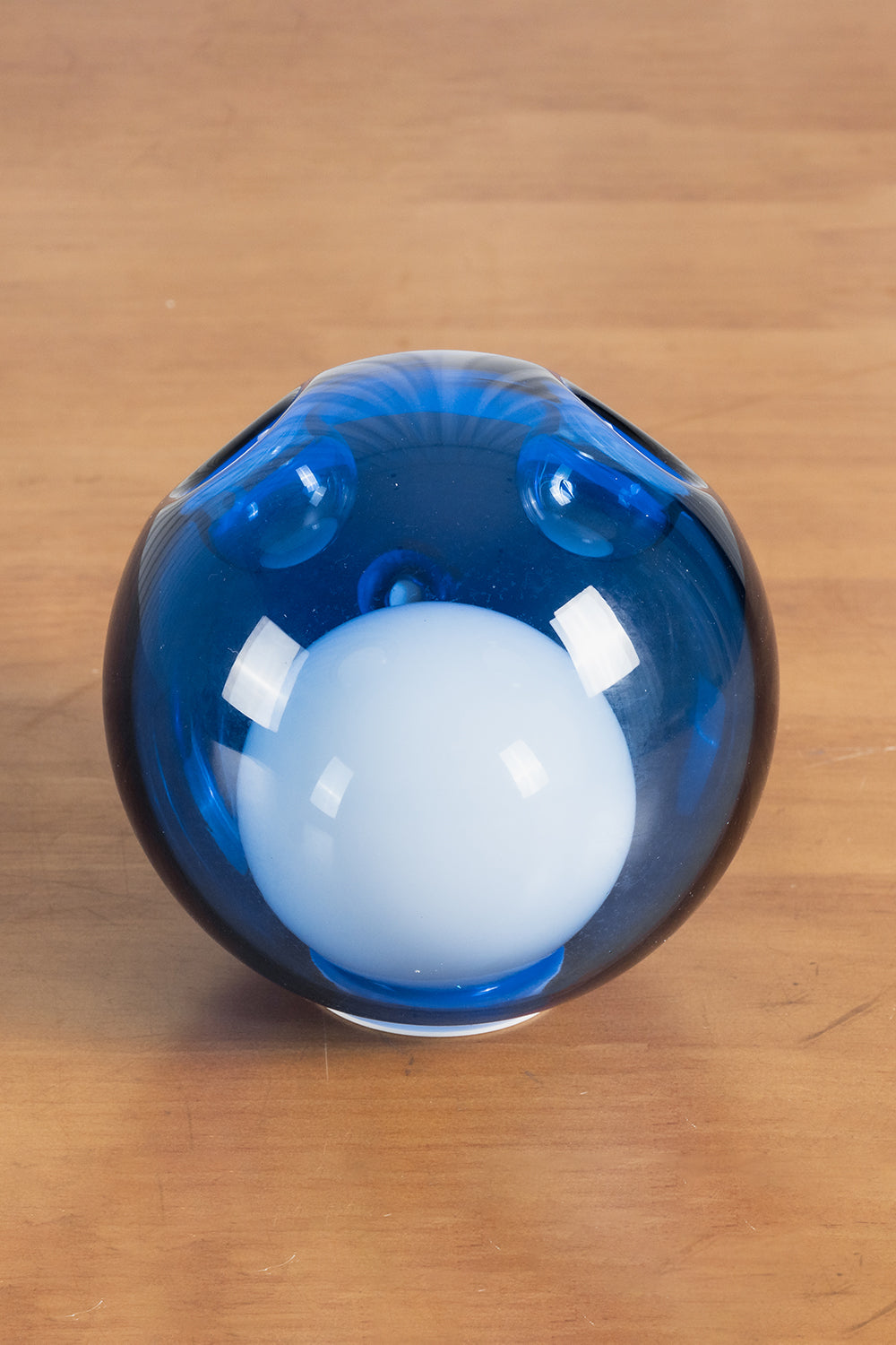 Rainbow Glass Bubble Cluster Chandelier | Glass, Metal | Detailed close-up shot of a single glossy dark blue glass globe with an internal frosted light core diffuser | Detail shot | vexa lamps