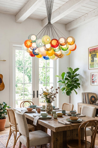 Rainbow Glass Bubble Cluster Chandelier | Glass, Metal | Suspended as a vibrant statement centerpiece above a wooden dining table in a bright rustic dining room facing open garden doors | vexa lamps