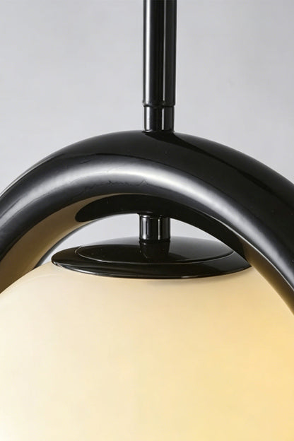 Close-up of the rhythmic flow pendant in black finish | Metal, Glass | Detailed shot of the metal bracket and cord connection | vexa lamps