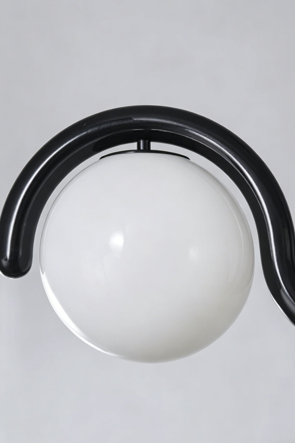 Close-up of the rhythmic flow pendant in black finish | Metal, Glass | Detailed shot of the metal bracket and cord connection | vexa lamps