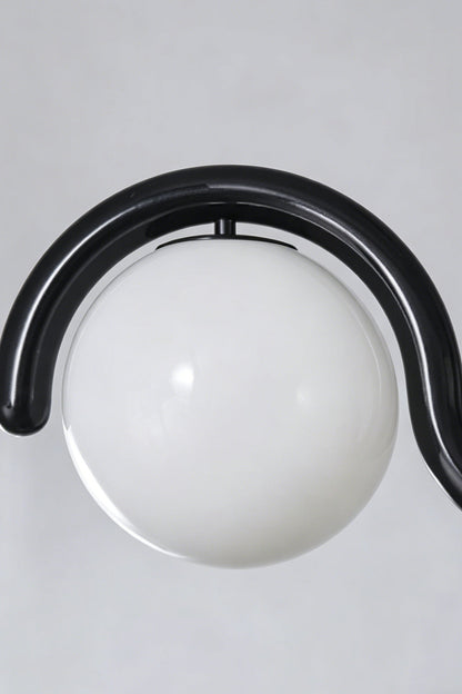 Close-up of the rhythmic flow pendant in black finish | Metal, Glass | Detailed shot of the metal bracket and cord connection | vexa lamps