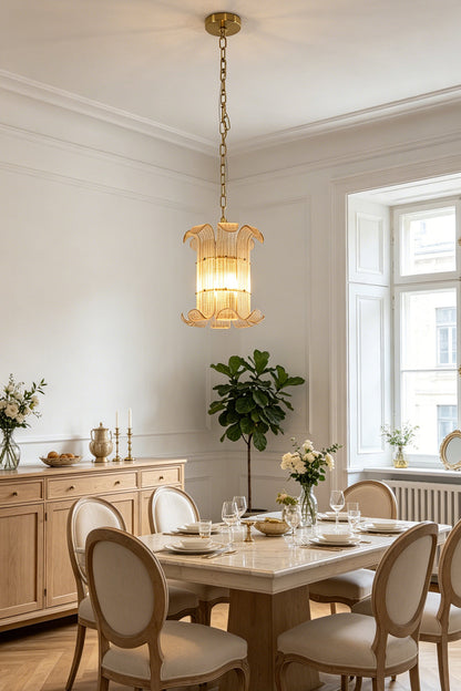 Elegant scroll ribbed glass chandelier | Metal | Glass | Installed in a sophisticated dining room interior | vexa lamps