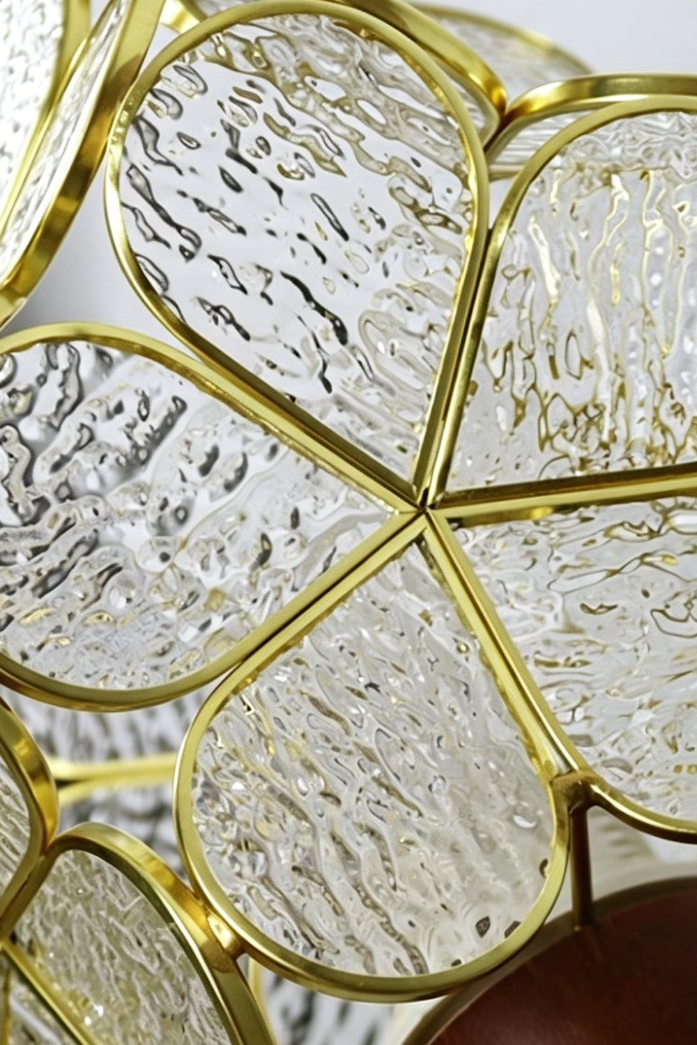 Rosalind Petal Glass Botanical Wall Lamp | Glass, Metal, Wood | Macro close-up view highlighting the detailed water-ripple texture of the glass panels secured inside the gold petal wireframe | Detail shot | vexa lamps