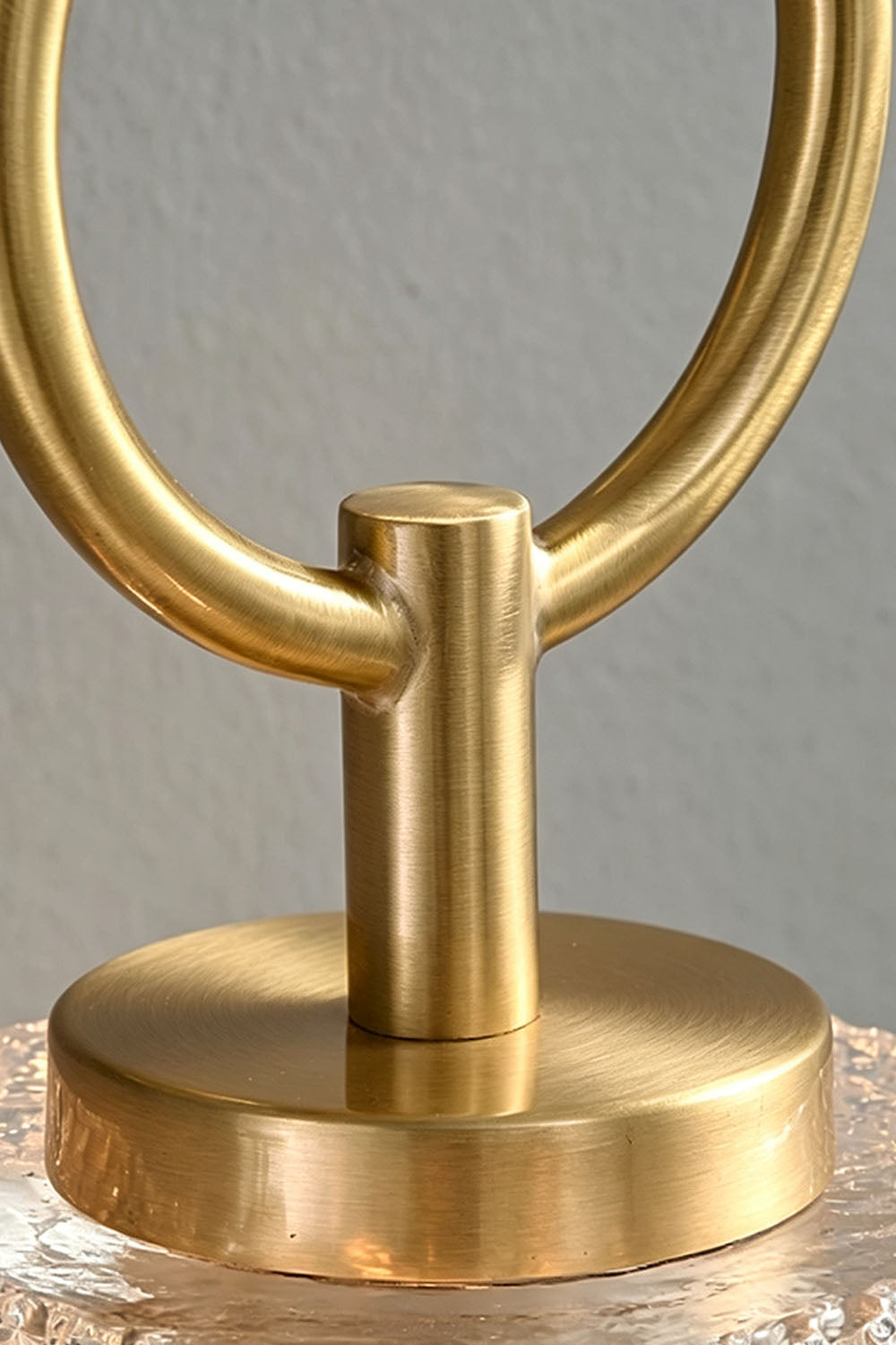 Rosamund Faceted Glass Wall Sconce | Faceted Glass and Brass | Macro close-up of the brass hanging ring and mounting hardware | vexa lamps