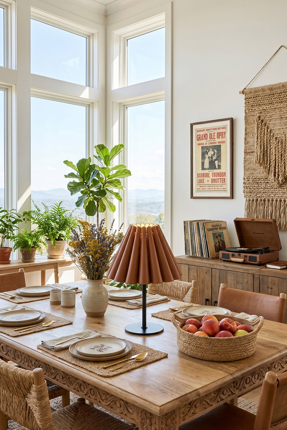 Rowan Leather Pleated Table Lamp | Leather, Metal | Serving as an elegant centerpiece on a long wooden dining table set in a sunlit corner dining room | vexa lamps