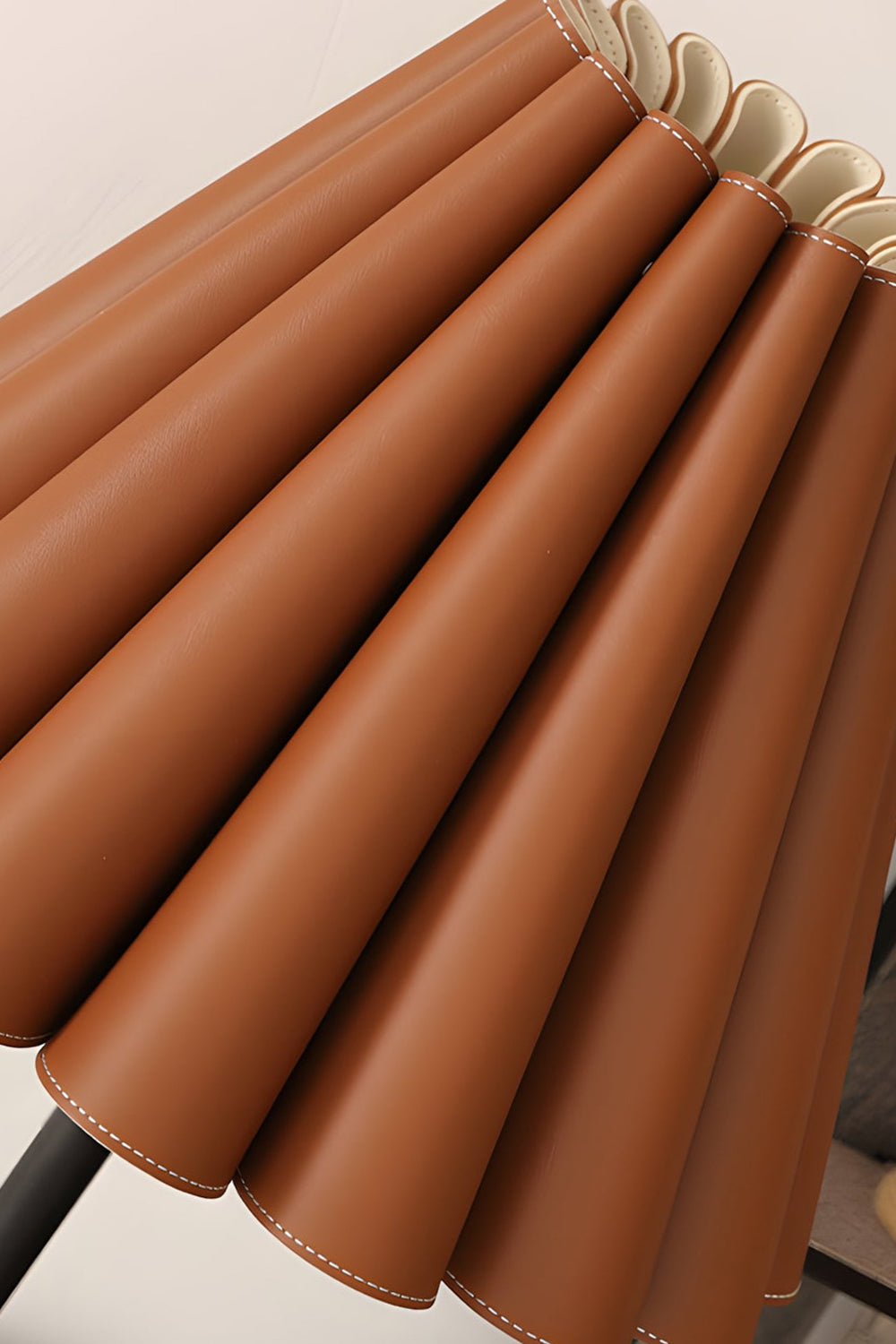 Rowan Leather Pleated Table Lamp | Leather, Metal | Macro close-up view highlighting the rich texture, crisp folds, and fine details of the tan pleated leather shade | Detail shot | vexa lamps