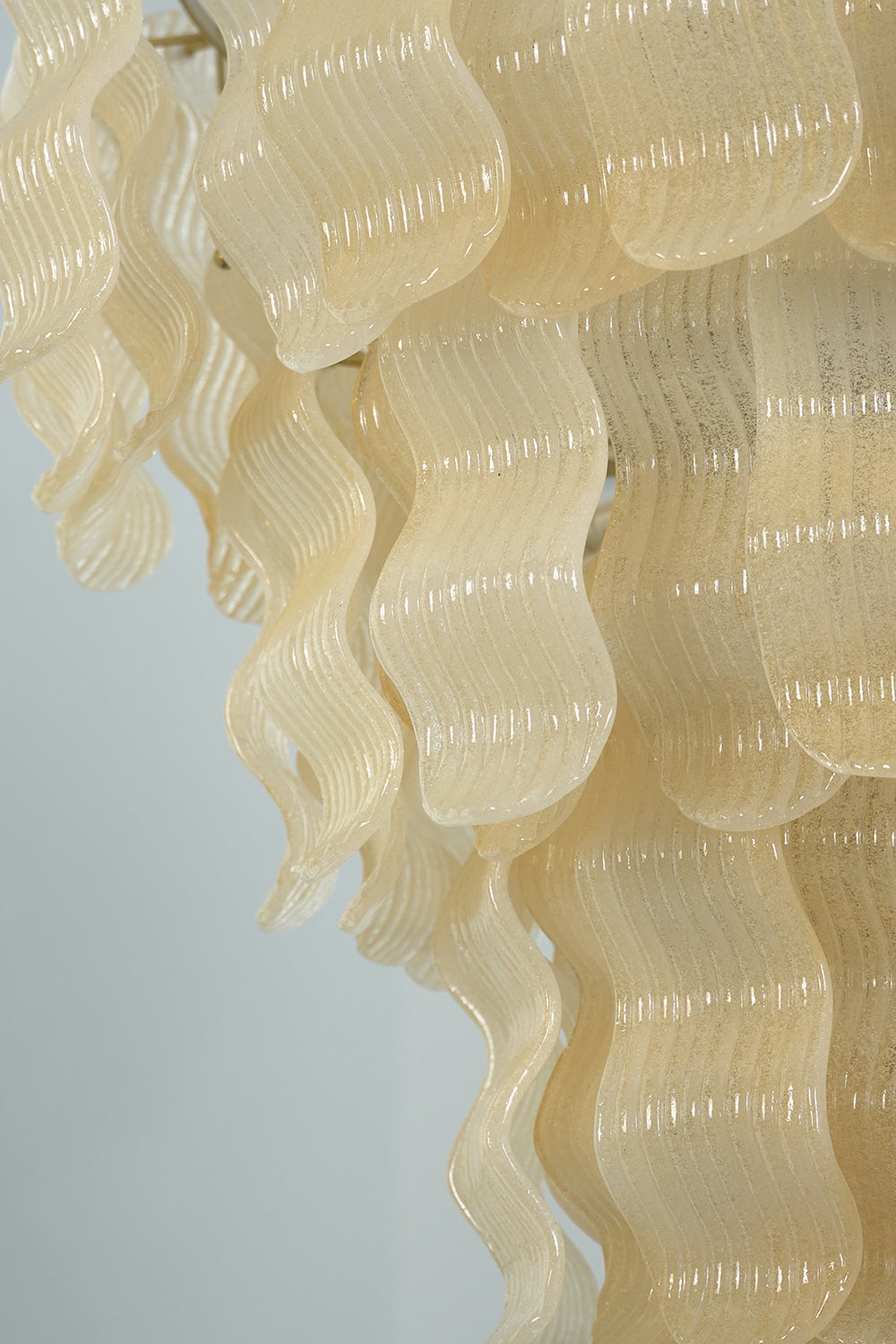 Tiered profile of ruffled glass panels | Glass | Detail shot showing the cascading glass layers | vexa lamps