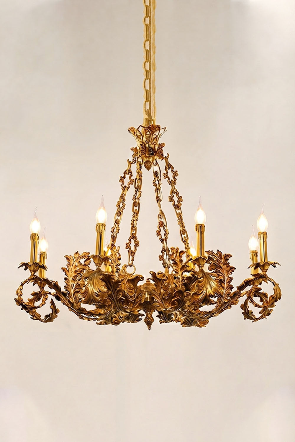 Rurik Acanthus Leaf Brass Chandelier with ornate leaf design and six candle-like lights.