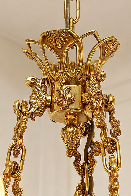 Rurik Acanthus Leaf Brass Chandelier with intricate design and gold finish, highlighting delicate leaf patterns.