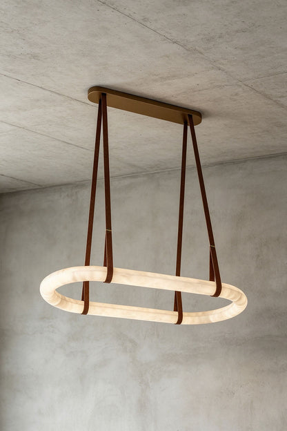 Selwyn Racetrack Alabaster Leather Pendant Light | Natural Alabaster, Leather and Metal | Side view of the glowing racetrack alabaster pendant light | vexa lamps