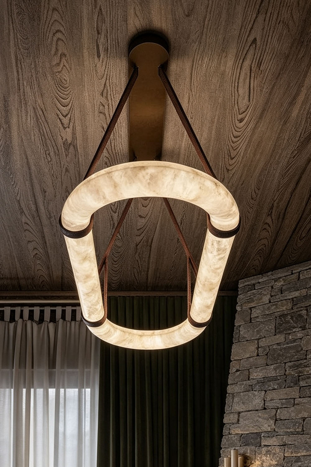 Selwyn Racetrack Alabaster Leather Pendant Light | Natural Alabaster, Leather and Metal | Bottom-up perspective shot of the glowing oval alabaster ring | vexa lamps
