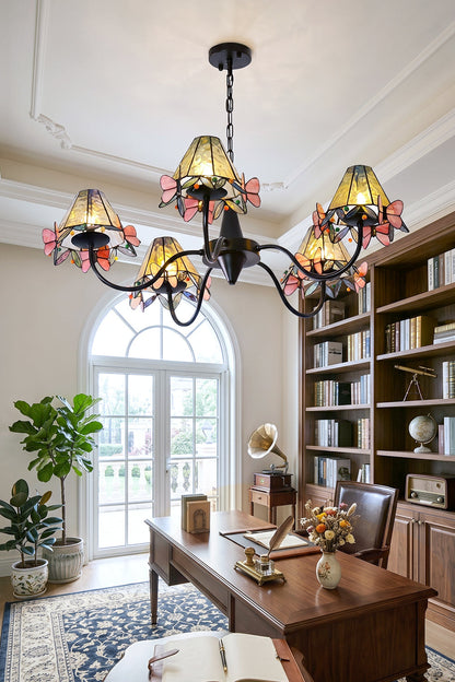 Seraphina Stained Glass Chandelier | Glass, Metal | Hanging in a modern office setup beside built-in bookshelves and facing an arched window | vexa lamps