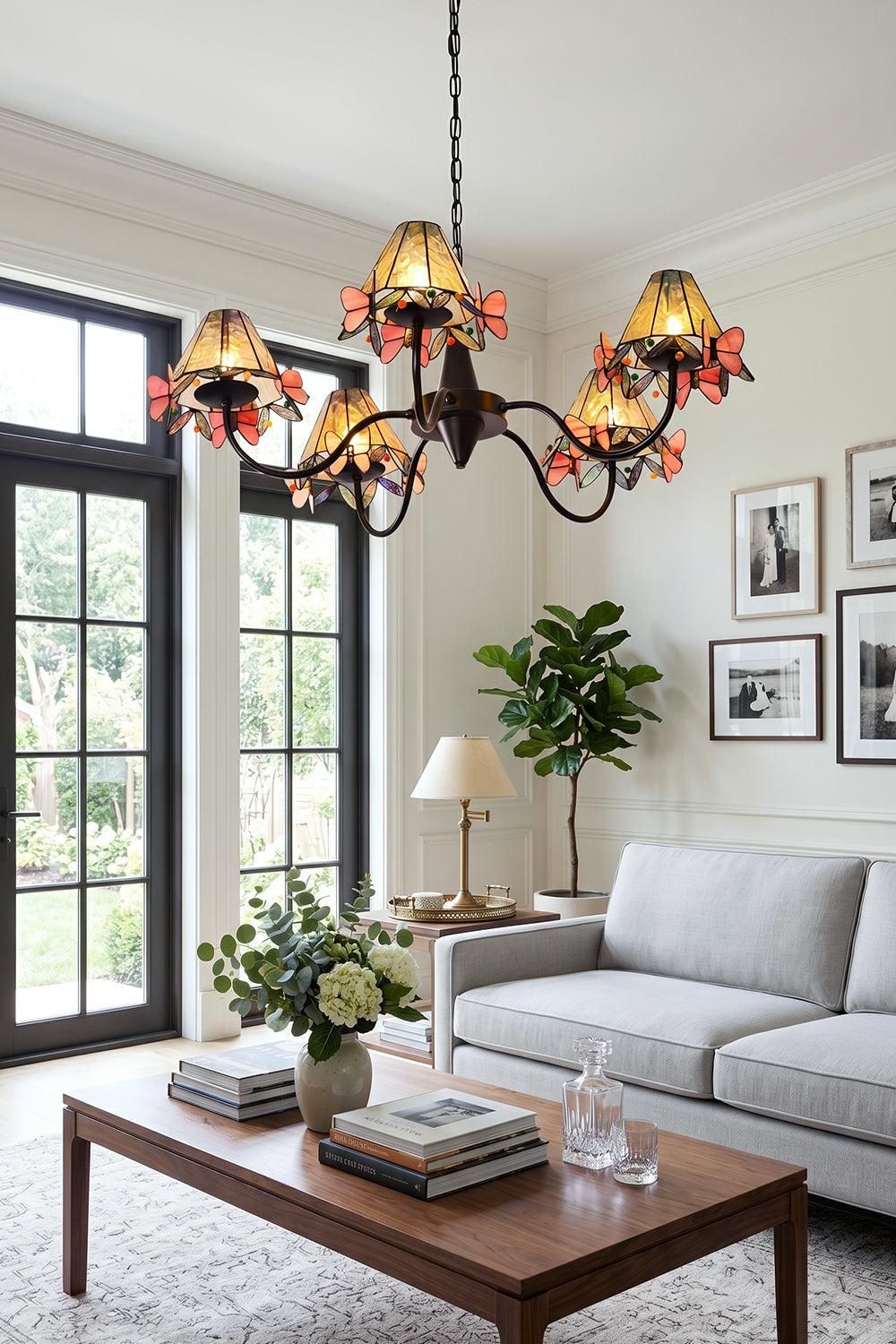 Seraphina Stained Glass Chandelier | Glass, Metal | Positioned as central lighting in a sunlit living room with comfortable grey sofas and a wooden coffee table | vexa lamps