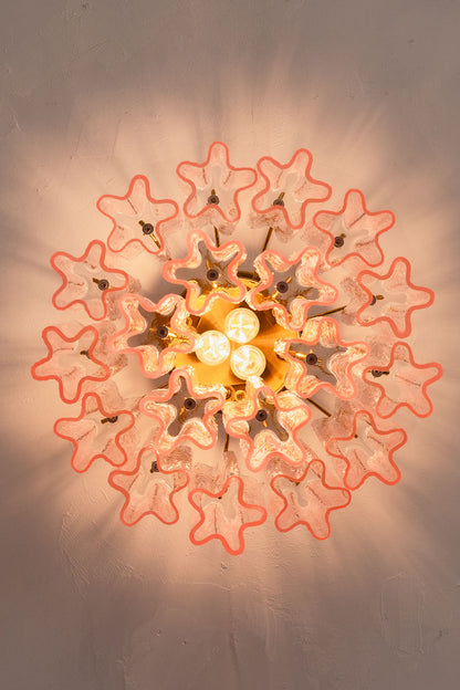 Seraphine Starburst Glass Tube Ceiling Light | Pink Glass and Brass | Bottom-up perspective showing the starburst light shadow pattern on the ceiling | vexa lamps