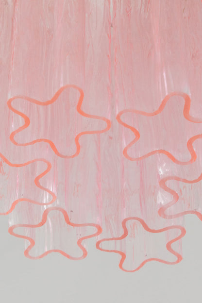 Seraphine Starburst Glass Tube Ceiling Light | Pink Glass and Brass | Detail shot highlighting the star-shaped profile of the pink glass tubes | vexa lamps