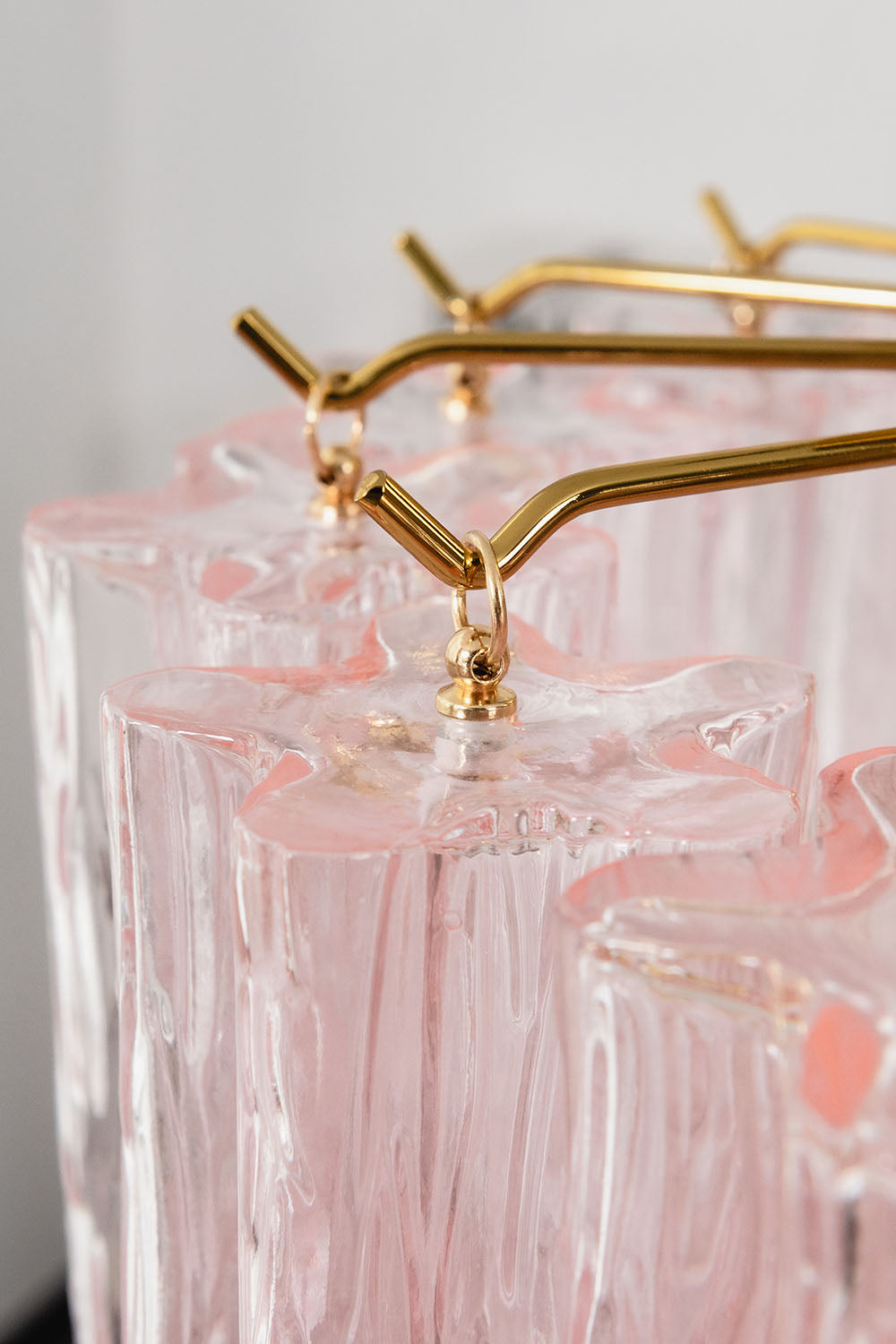 Seraphine Starburst Glass Tube Ceiling Light | Pink Glass and Brass | Macro close-up of the brass branches holding the pink glass tubes | vexa lamps