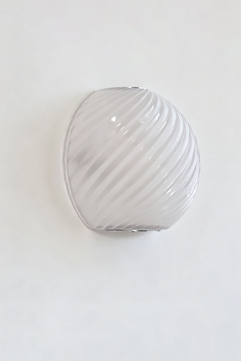 Silas Ribbed Glass Wall Sconce | Ribbed Glass, Metal | Studio unlit view of the white frosted opal ribbed glass finish option displaying its smooth textured surface | vexa lamps