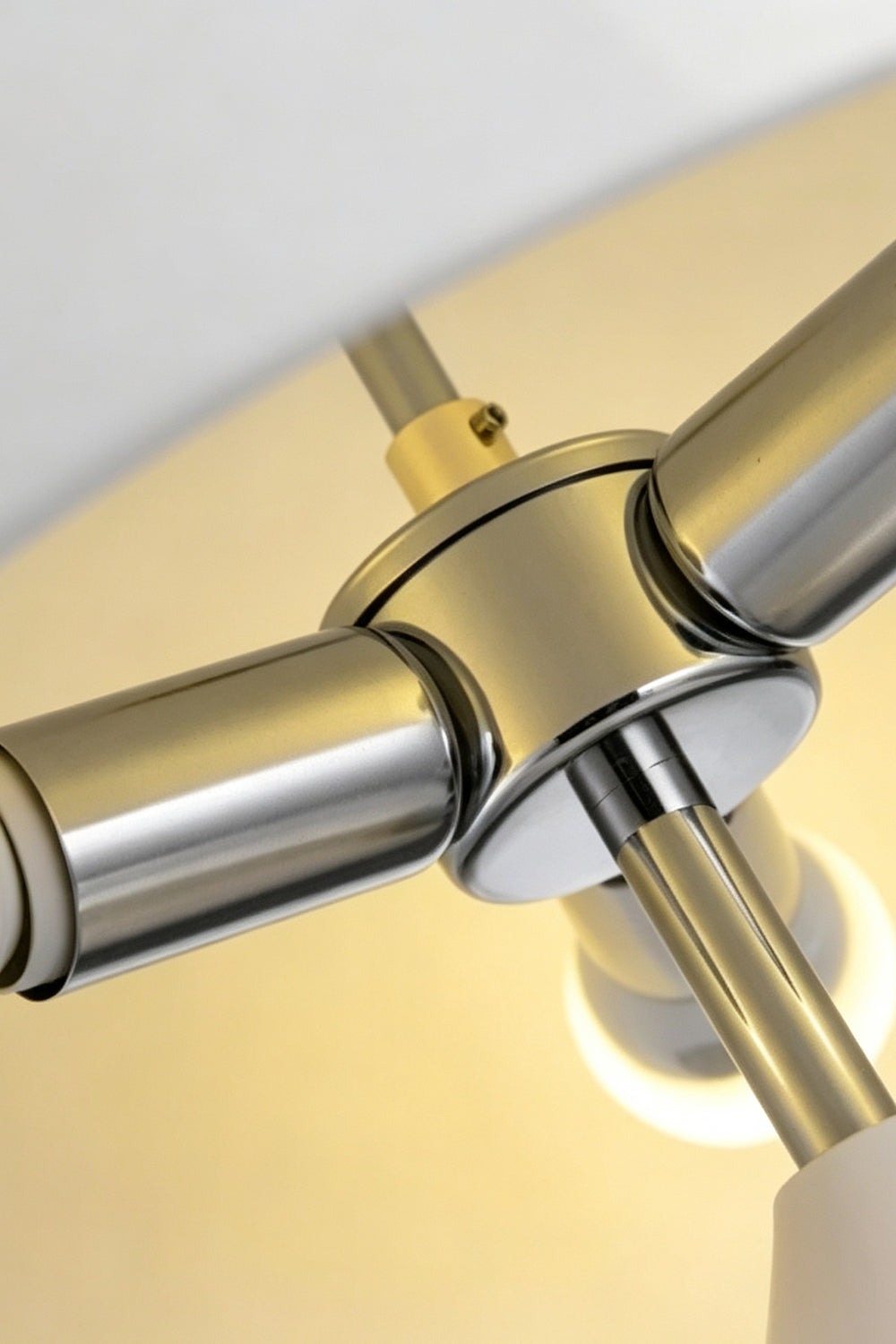 Solene Domed Glass Table Lamp | White Frosted Glass | Macro close-up shot focusing on the internal polished gold and chrome metal hardware structure | vexa lamps