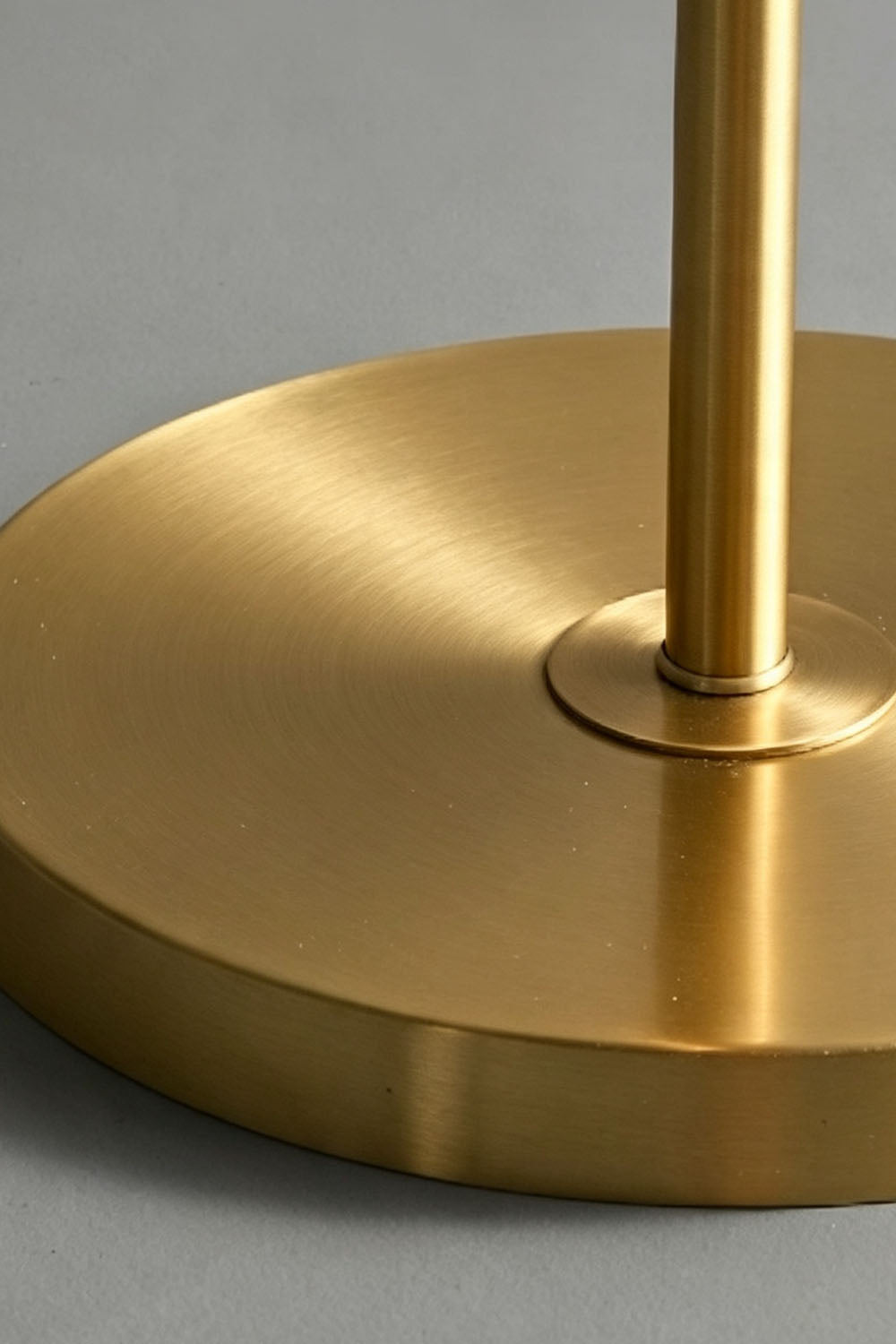 Solene Stacked Glass Table Lamp | Textured Glass and Brass | Close-up view of the smooth circular brass base and stem | vexa lamps
