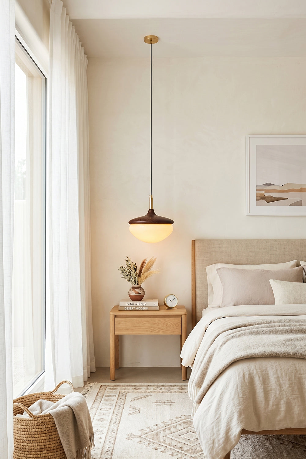Soren Wood Grain Pendant Lamp | Wood, Glass, Metal | Hanging as a cozy bedside light over a light wood nightstand in a soft cream-toned bedroom | vexa lamps