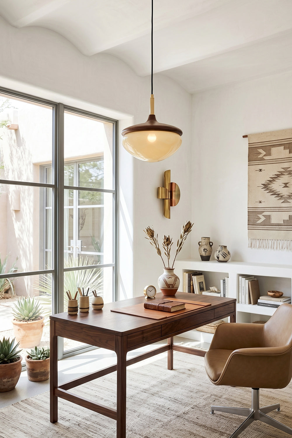 Soren Wood Grain Pendant Lamp | Wood, Glass, Metal | Providing warm task lighting over a dark wood desk and leather chair in a sunlit workspace | vexa lamps