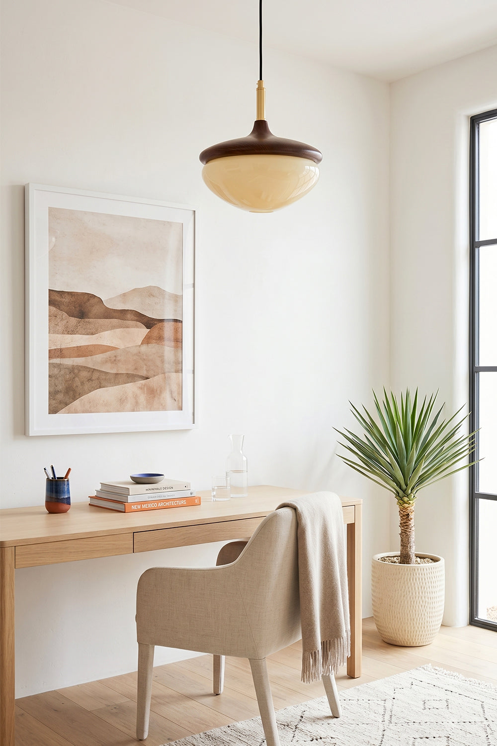 Soren Wood Grain Pendant Lamp | Wood, Glass, Metal | Suspended over a minimalist light wood writing desk with a cream chair and desert art frame | vexa lamps